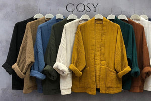 Quilted Jackets in nine different colours hung in a line