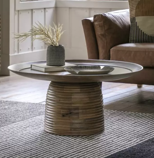 Mango wooden table with distinctive 'Beehive' design base with a wide overhanging tray top.  Situated in living room with vase, book and tray on it