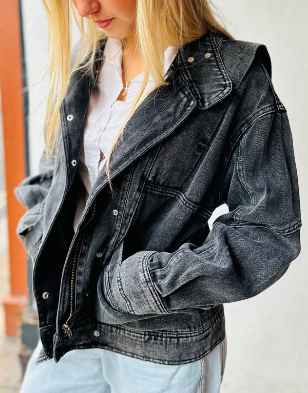 model wears a Faded Black denim jacket with 80s design lapels