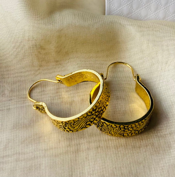 Embossed gold hoop earrings in a gift box