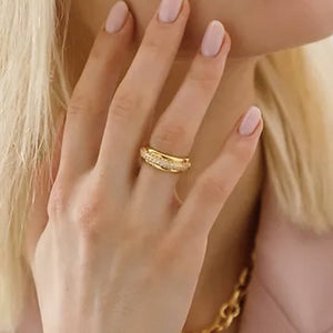 Model wears Cubic Zirconia Halo Ring on her finger.  A gold band with zirconia detail inlay