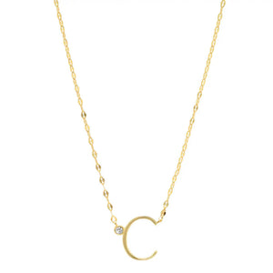 Personalised Gold Letter And Diamond Necklace against a white background. The letter C is shown. Gold chain with diamond sitting next to the letter